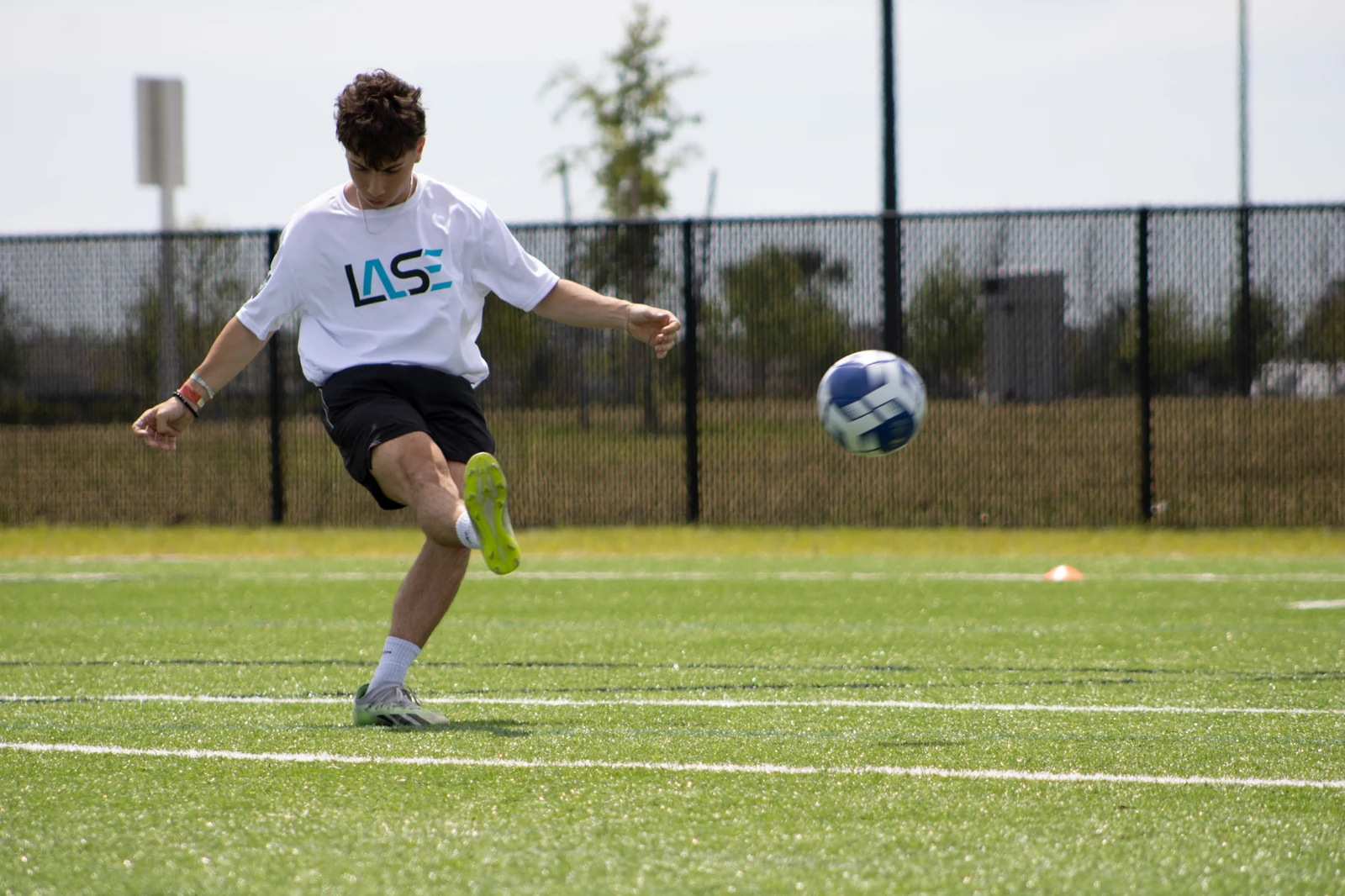 LASE player practising on the soccer field